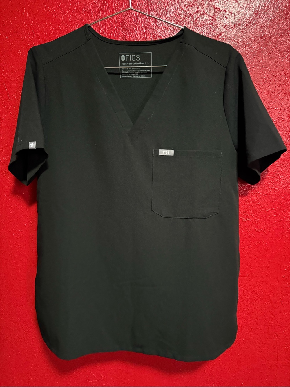 8. Pre loved Catarina Woman’s FIGS Black V-Neck Scrub Top with Chest Pocket